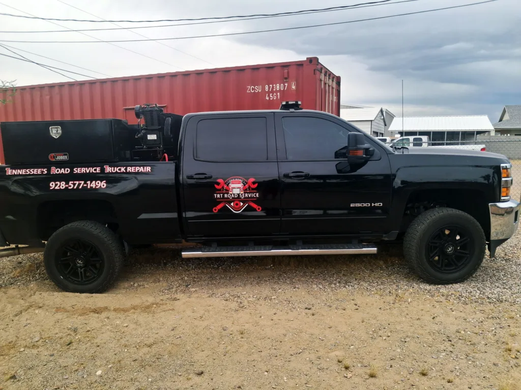 Black Chevrolet 2500 HD service truck with TRT Road Service branding for mobile diesel repair in Mohave Valley AZ.